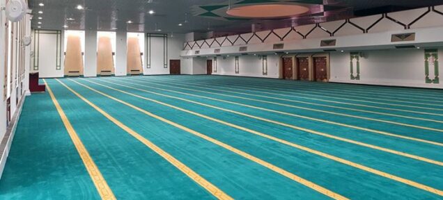 Newly installed green carpet in prayer hall