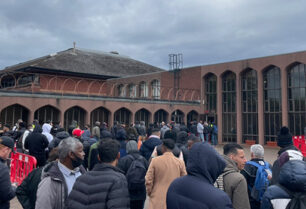 People in queue waiting for food packs outside of Glasgow Central Mosque